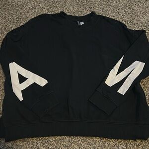 H&M black hoodie with letters, A and M on the arm